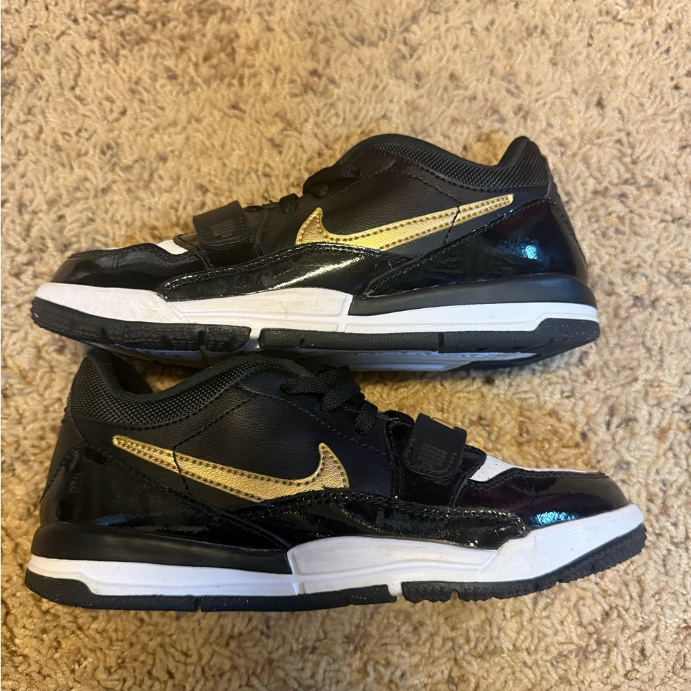 Nike Black and Gold Sneakers with Air Cushioning